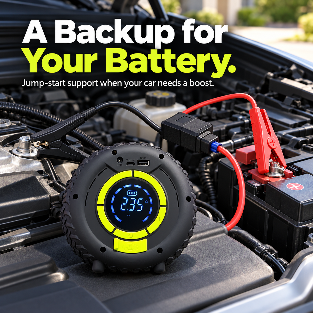 Portable car jump starter connected to a vehicle battery